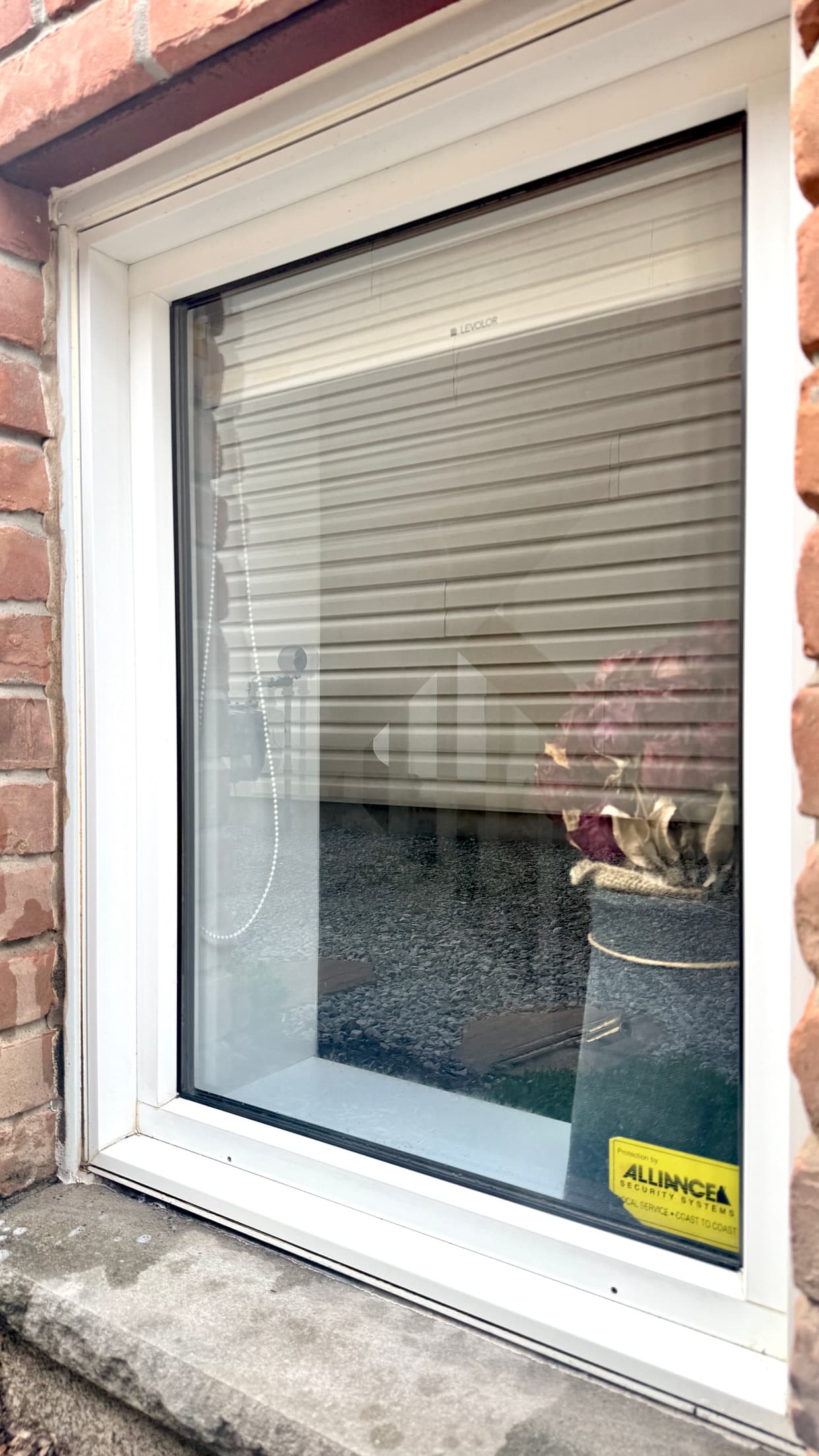 Window after cleaning with clear glass and brighter reflections