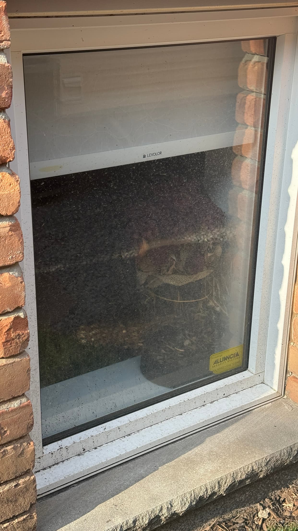 Window before cleaning with visible dirt and haze on the glass